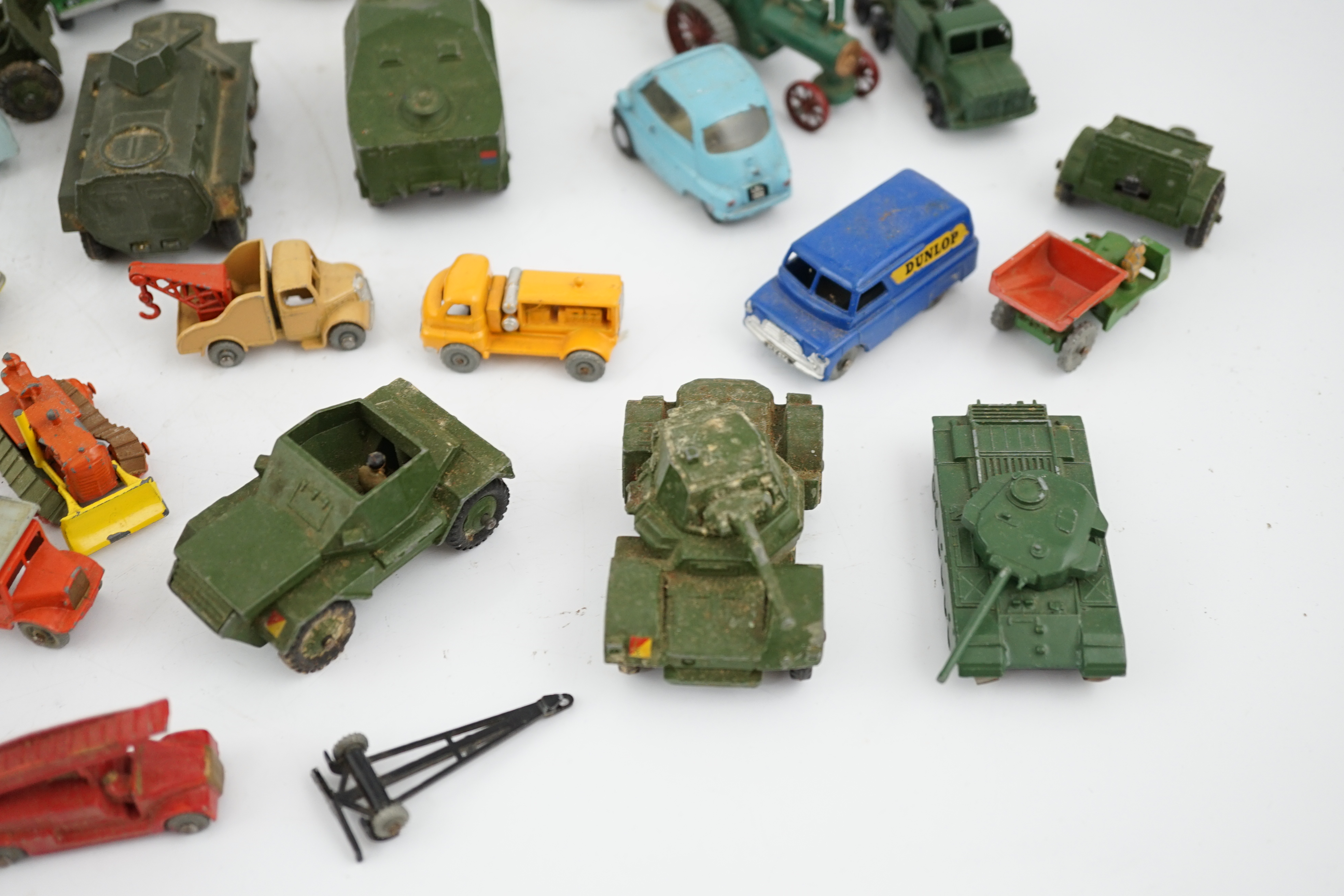 Thirty-eight diecast vehicles by Dinky Toys, Corgi Toys, Matchbox, etc. including a Spot-On BMW Isetta, military Dinky vehicles, Matchbox Series, etc.